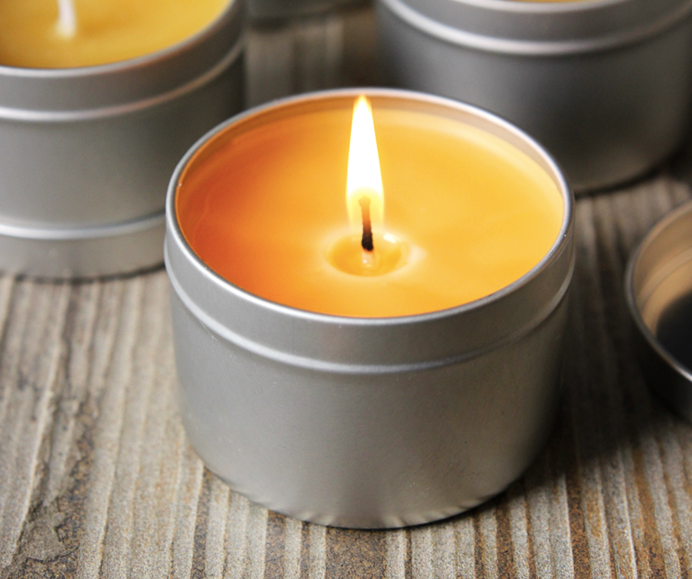 Beeswax candle in a tin